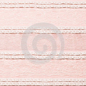 Ivory lace fabric on pink background