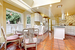 Ivory and white kitchen room with dining table set