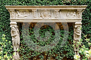 Ivy-covered carved fireplace of Villa Balbianello. Lake Como, Italy