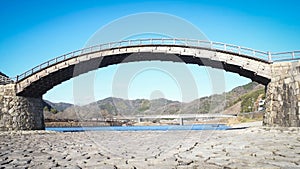 Iwakuni Yamaguchi Japan Kintaikyo Bridge over the Nishiki River with blue sky - The 5-arched wooden bridge is a cultural property