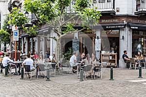 Ixelles, Brussels Capital Region - Belgium - Typical Belgian brasserie at the corner of a lively street in the neighborhood