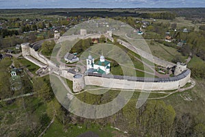 Izborsk fortress in spring landscape aerial view. Old Izborsk. Pskov region