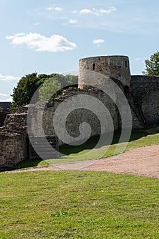 Izborsk, Russia, September 7, 2023. A fragment of a dilapidated fortress wall with a tower.