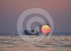 Izmir aliaga yenisakran bay fishermans in the boat and sun