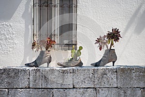 Recycled shoes used as flowerpots. Urla, Izmir, Turkey