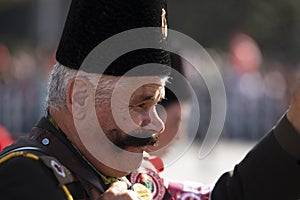 Portrait of Celal Dolasir The Combat Veteran with his uniform and wife. He has a Beautiful and masculine mustache