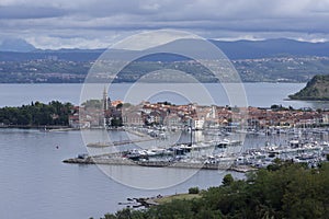 Izola / Slovenia - September 9, 2019: Aerial view over the sea beautiful Izola town, with old town and harbor