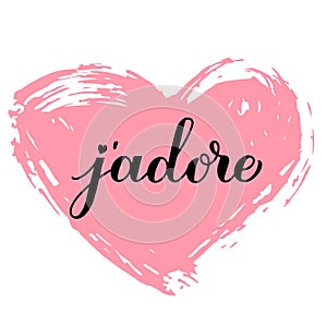 J adore calligraphy hand lettering on grunge heart. I adore inscription in French. Valentines day greeting card. Vector