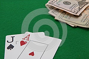 Jack and ace blackjack cards with on green