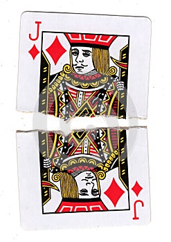 A jack of diamonds playing card torn in half.