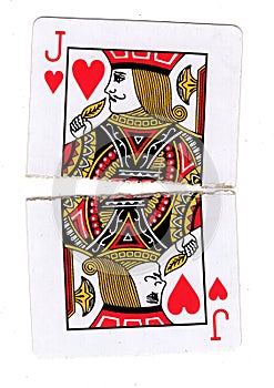 A jack of hearts playing card torn in half.