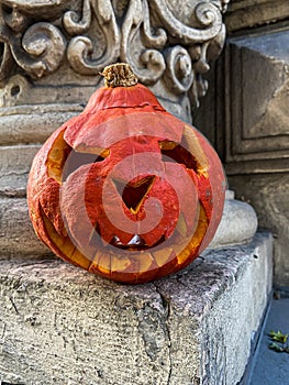 Jack-o`-lantern carved pumpkin with ghoulish face. Halloween tradition photo