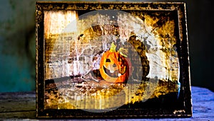 Jack o` lantern in a vintage frame