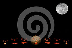 Jack o-lanterns and full moon with space for text