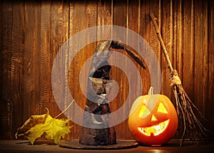 Jack o lanterns Halloween pumpkin face on wooden background