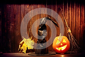 Jack o lanterns Halloween pumpkin face on wooden background