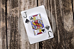 Jack of Spades Card on Wood