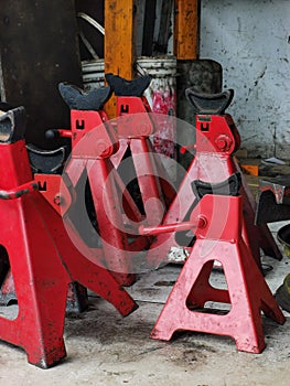 Jack stands in the car workshop.