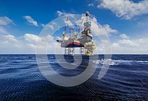 Jack up rig with oil platform at sea with blue sky