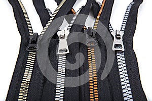 Jacket Winter Coat Black Tape Heavy Duty Zippers Large Molded Plastic Zippers. Close-up of zipper slider on a white surface.