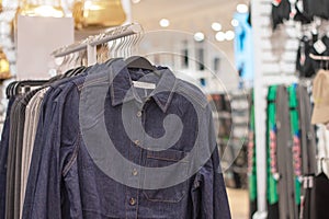 Jackets on hangers in a shop window