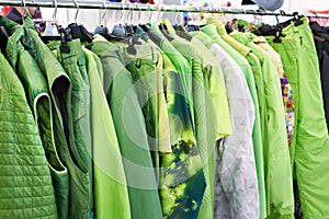 Jackets, waistcoats and rainwear on hanger in store