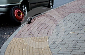 Jacking up a car to change a tyre after a roadside