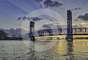 JACKSONVILLE, FLORIDA MAIN ST BRIDGE AT SUNSET WITH GOD RAYS