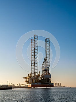 Jackup drilling rig hooked up to shore-to-ship power at Doggerkaj at Esbjerg harbor, Jutland, Denmark