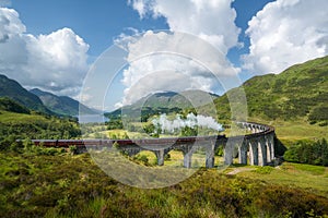 Jacobite steam train, a.k.a. Hogwarts Express, passes Glenfinnan viaduct