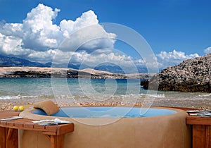 Jacuzzi at the beach with cloudy sky