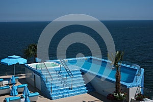 Jacuzzi with pool on the open terrace of the penthouse overlooking the sea. Jacuzzi on the cruise ship. luxury vacation