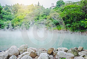 The jade-like hot spring at Beitou Thermal Valley is releasing sulphuric steam.