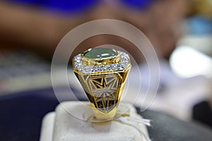 Jade ring Is a gold ring decorated with jade and genuine diamonds