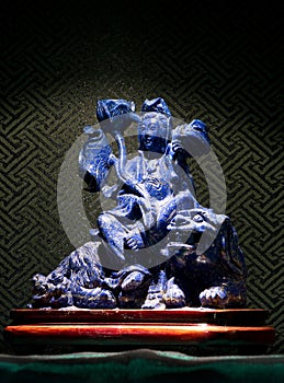 Jade sculpture of Guanyin on lion, Goddess of Mercy in China