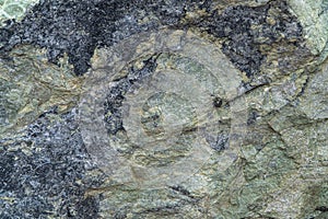 Jadeite ore texture close-up. Contains jadeite and other pyroxenes. Mineral stone surface background.