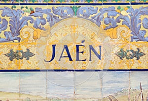 Jaen sign over a mosaic wall