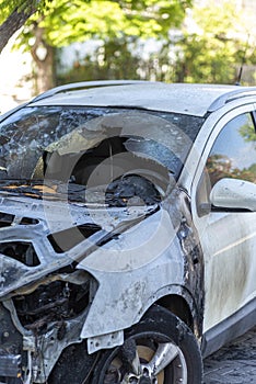 Jaffa, Tel Aviv, Israel. Burned car close up. Car after the fire, crime of vandalism, riots. Arson car. Accident on the