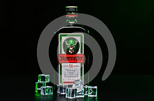 Jagermeister  on  dark background with ice cubes