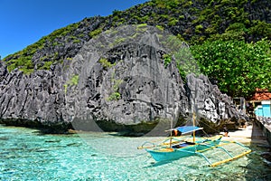 Jagged limestone cliffs of Matinloc Island at Palawan in Philippines