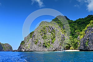 Jagged limestone cliffs of Matinloc Island, Philippines