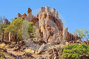 A jagged rocky outcrop in a semi arid part of Australia.