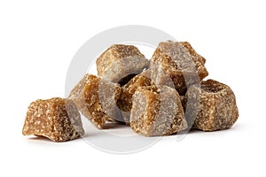 Jaggery, cube shaped unrefined sugar on white