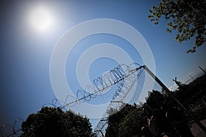 Jail fence sky sun