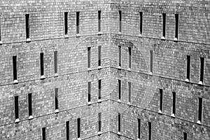 Jail or Prison harsh brick exterior. Thin windows let in a minimum of light and offer maximum security.