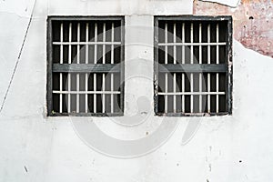 Jail`s window on white wall