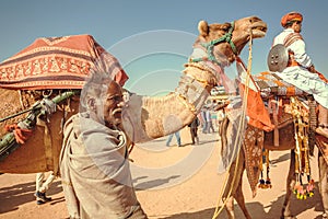 Camel rider in caravan of the outdoor Desert Festival of Rajasthan