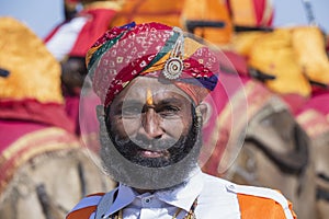 Indian man wearing traditional dress participate in mister desert contest of festival in Jaisalmer, Rajasthan, India