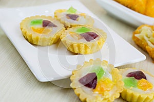 Jajanan pasar pie buah or fruit pie and risoles on white plate photo