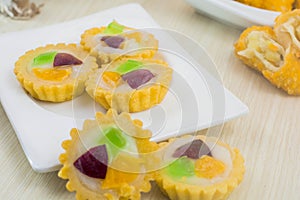 Jajanan pasar pie buah or fruit pie and risoles on white plate photo